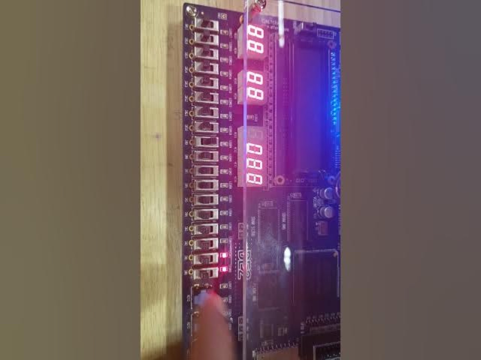 FPGA development board running the processor, with input switches and hexadecimal output on seven segment displays